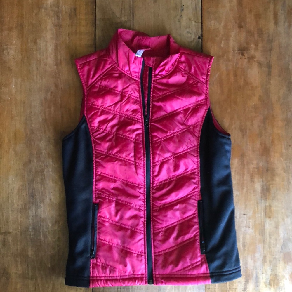 Red slightly puffy vest. Zip up